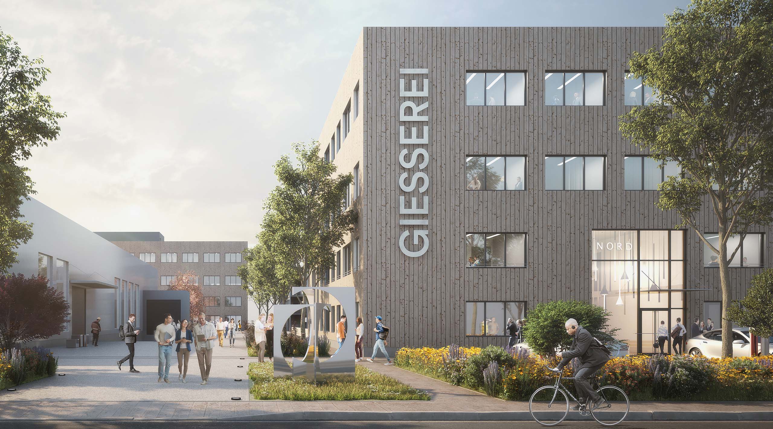 Office campus in Garching near Munich with a frontal view of the office building, Giesserei logo, passers-by and greenery